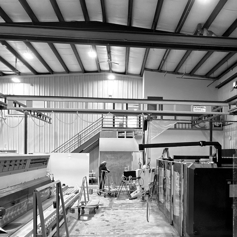 A bridge crane over the floor of a stone shop