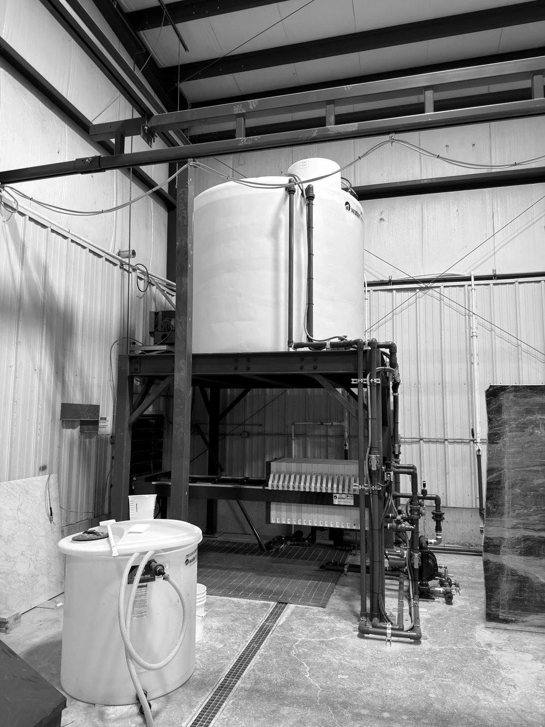 A stone shop's water recycling tank and filter press